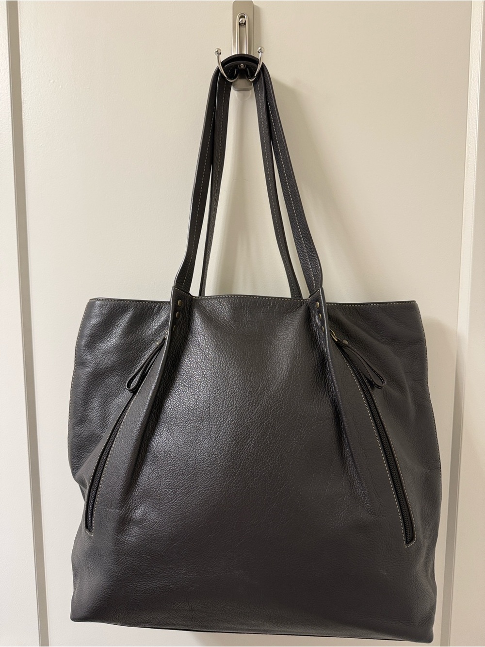 Dark brown soft supple pebble leather. Like new. Shoulder straps.